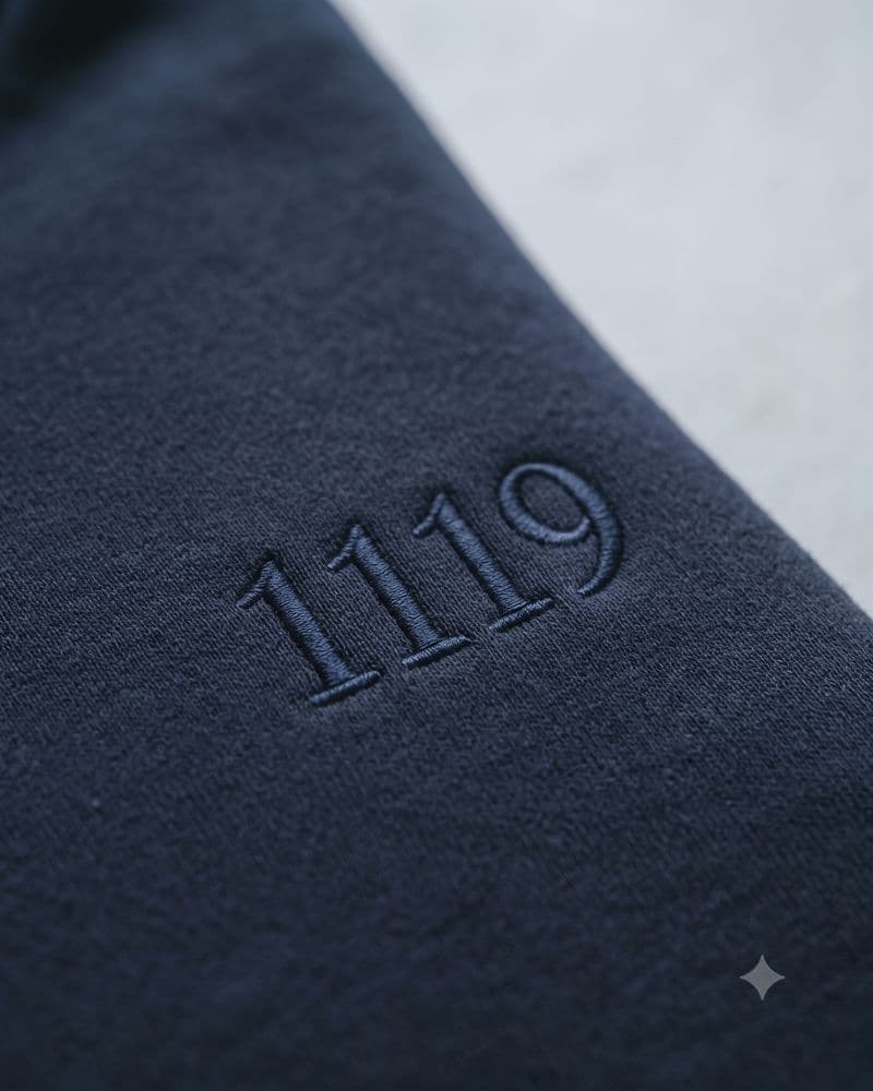 1119 embroidered tone-on-tone on navy fleece