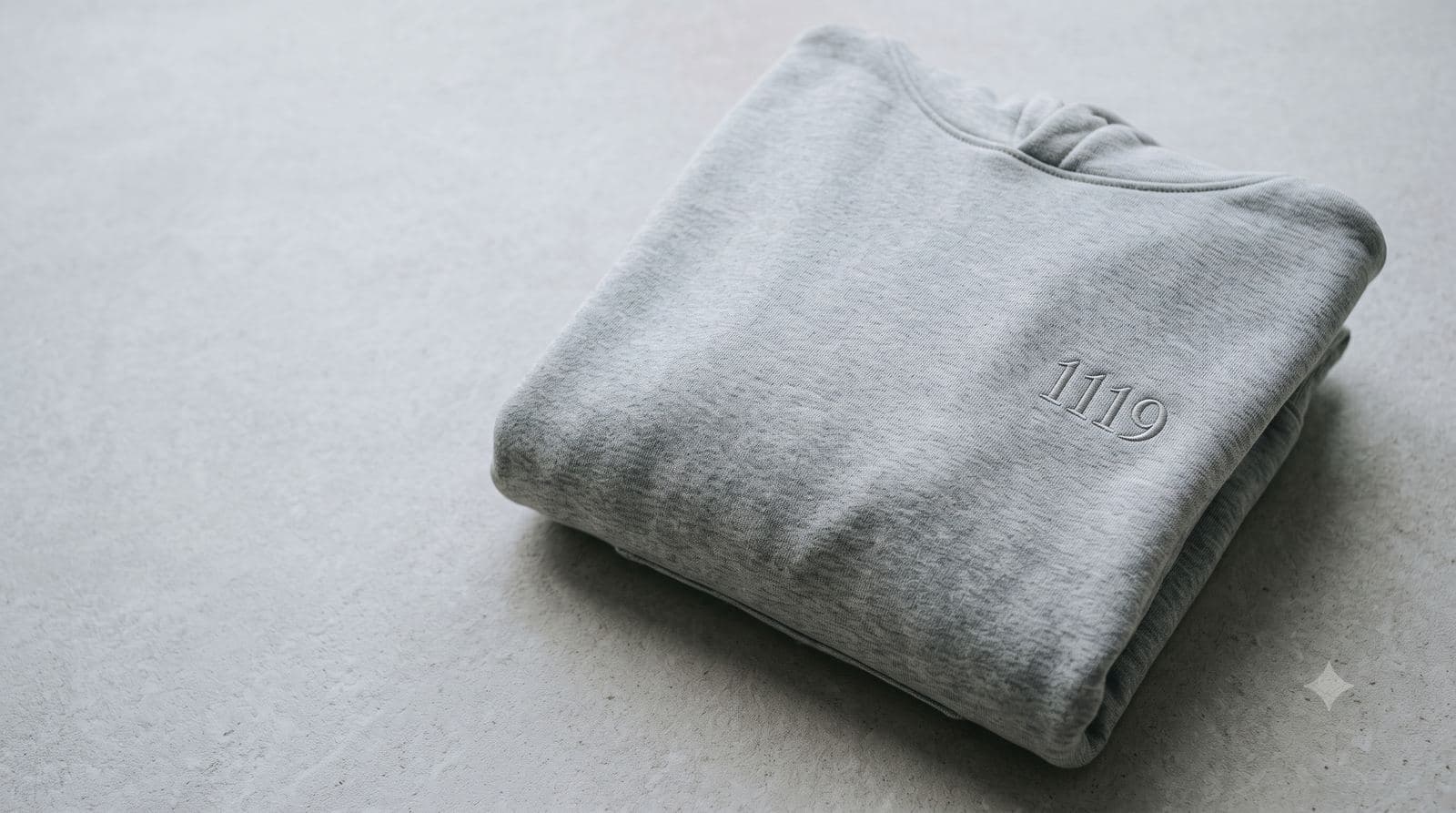 Light heather grey heavyweight hoodie with tonal 1119 embroidery on the chest